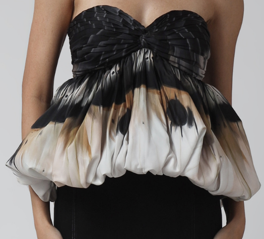 A sculpted peplum