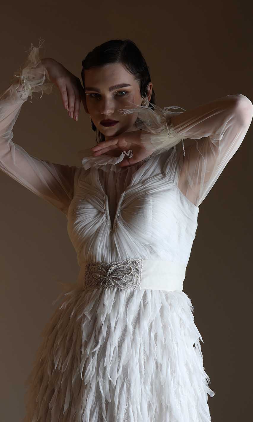Feathers and a jewelled waist